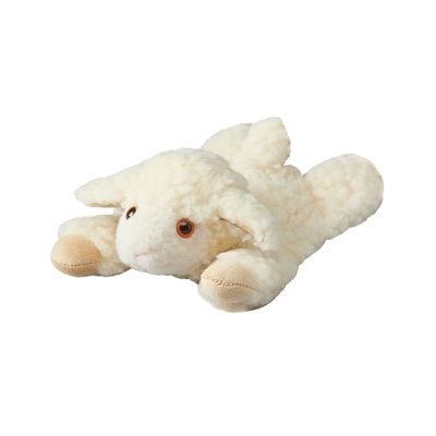 Schäfli aus Schurwolle mit Kirschsteinkissen liegend